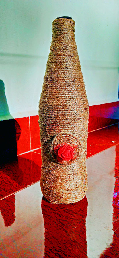 Jute and red rose recycled bottle art